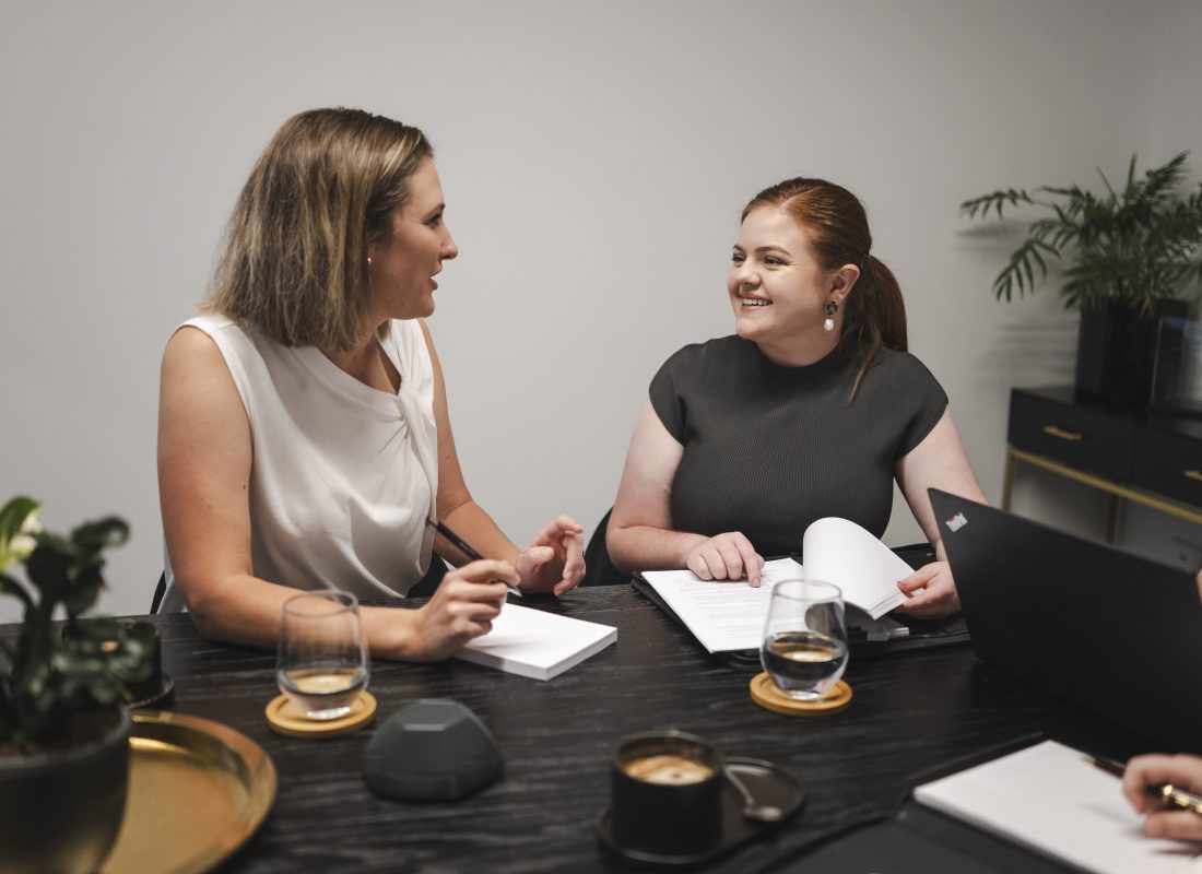 Professional women consulting on property and business law in Toowoomba, Queensland.