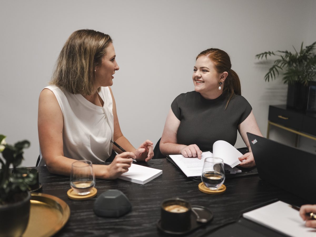 Professional women consulting on property and business law in Toowoomba, Queensland.