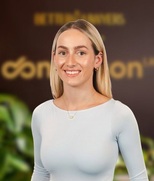 Business Law Expert. A professional woman standing in an office environment with Enterprise Legal branding, highlighting legal consultation and business law services in Australia.