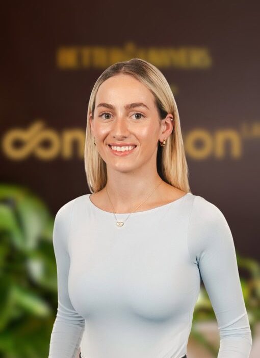A professional woman standing in an office environment with Enterprise Legal branding, highlighting legal consultation and business law services in Australia.