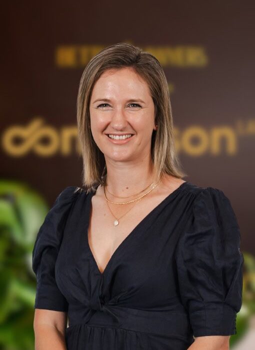 Professional woman smiling in office setting, highlighting expert legal services, corporate law, and business support from Enterprise Legal, Australia's trusted legal advisors.