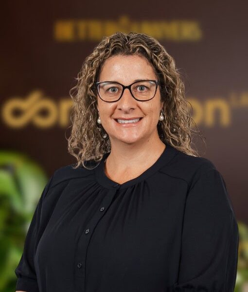 Legal Expert Woman. Professional woman with glasses in a legal office environment, representing trusted legal services and expertise at Enterprise Legal in Australia.