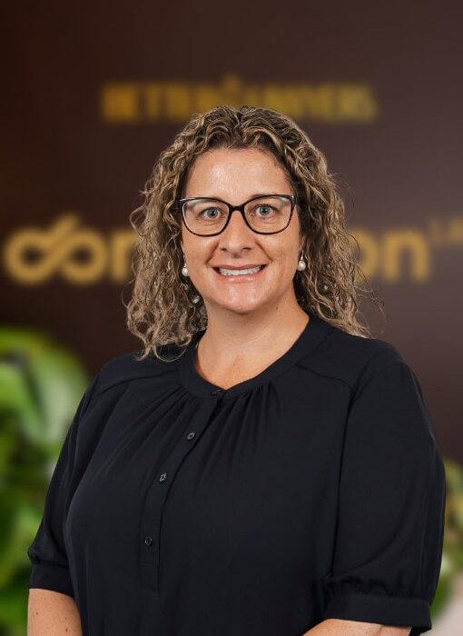 Professional woman with glasses in a legal office environment, representing trusted legal services and expertise at Enterprise Legal in Australia.
