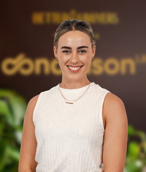 A confident young woman smiling, representing a professional legal advisor at Enterprise Legal, specialising in business law and legal services in Australia.